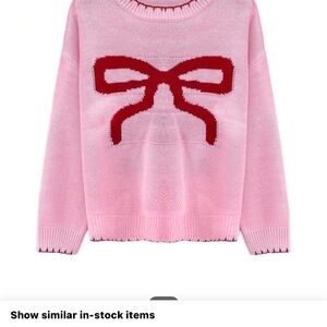 Pink Sweater with Red Bow Design